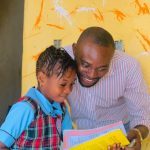 Teacher mentoring a pupil