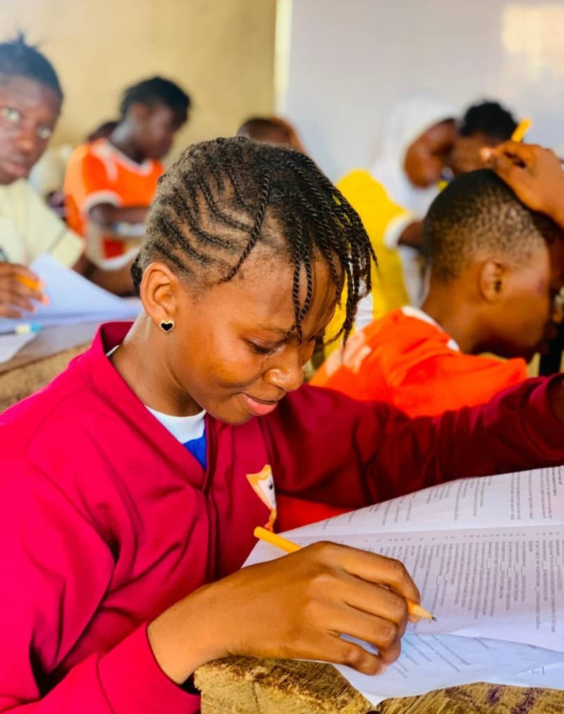 Secondary student writing an examination
